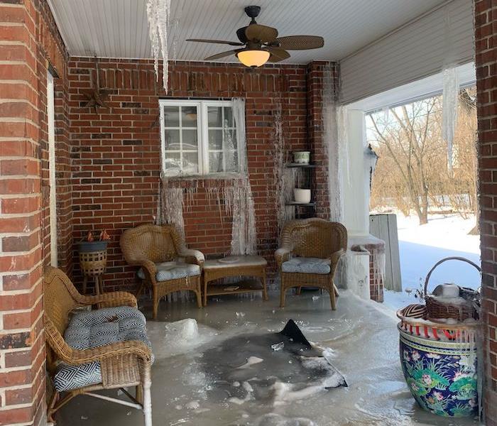 Porch with frozen water on ceiling and outdoor patio furniture