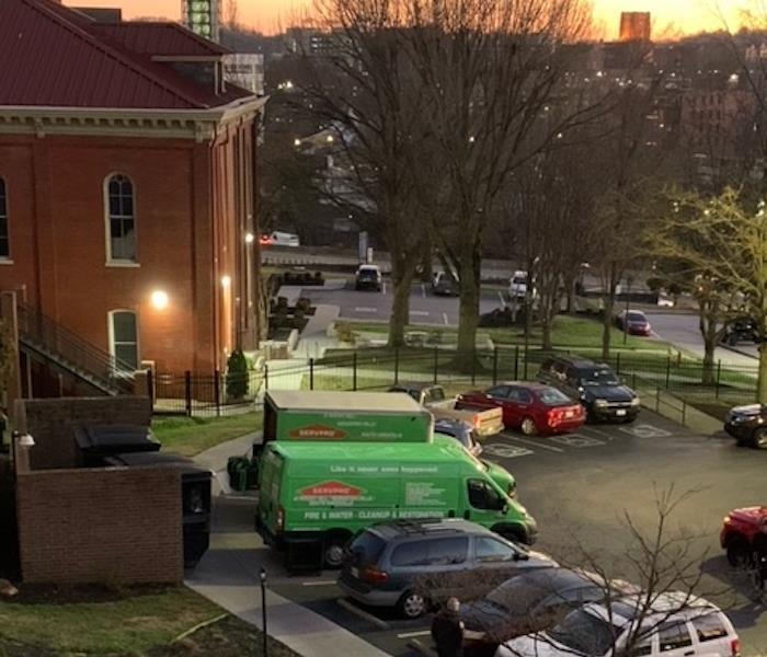 SERVPRO vehicles in a parking lot 