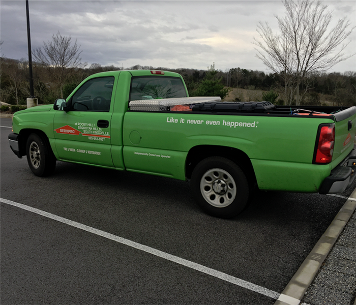 a SERVPRO vehicle in a parking lot