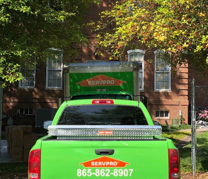pickup and box truck from SERVPRO back view with phone number