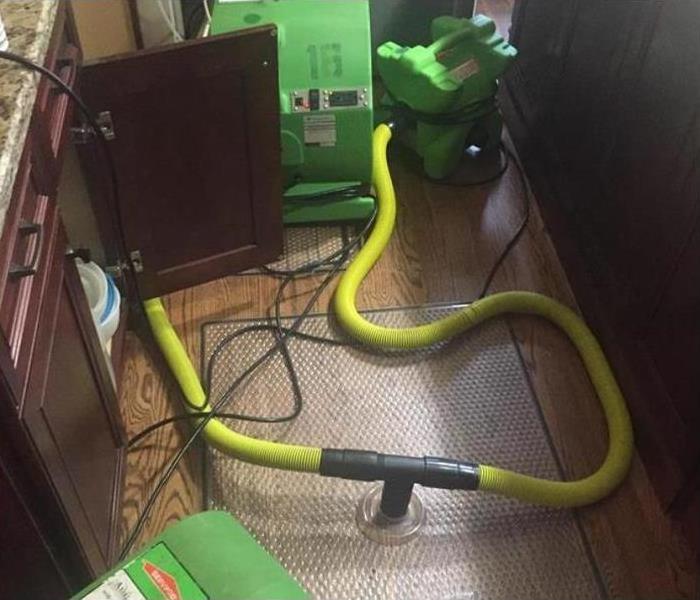 SERVPRO restoration equipment being used on water damaged floor