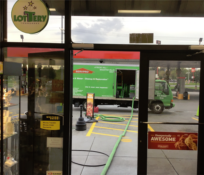 a SERVPRO vehicle outside of a gas station it is helping